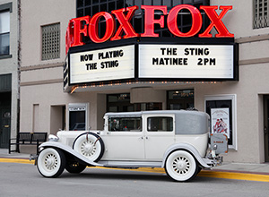 A preview image of the exterior of the Fox Theater showing the marquee and an antique car