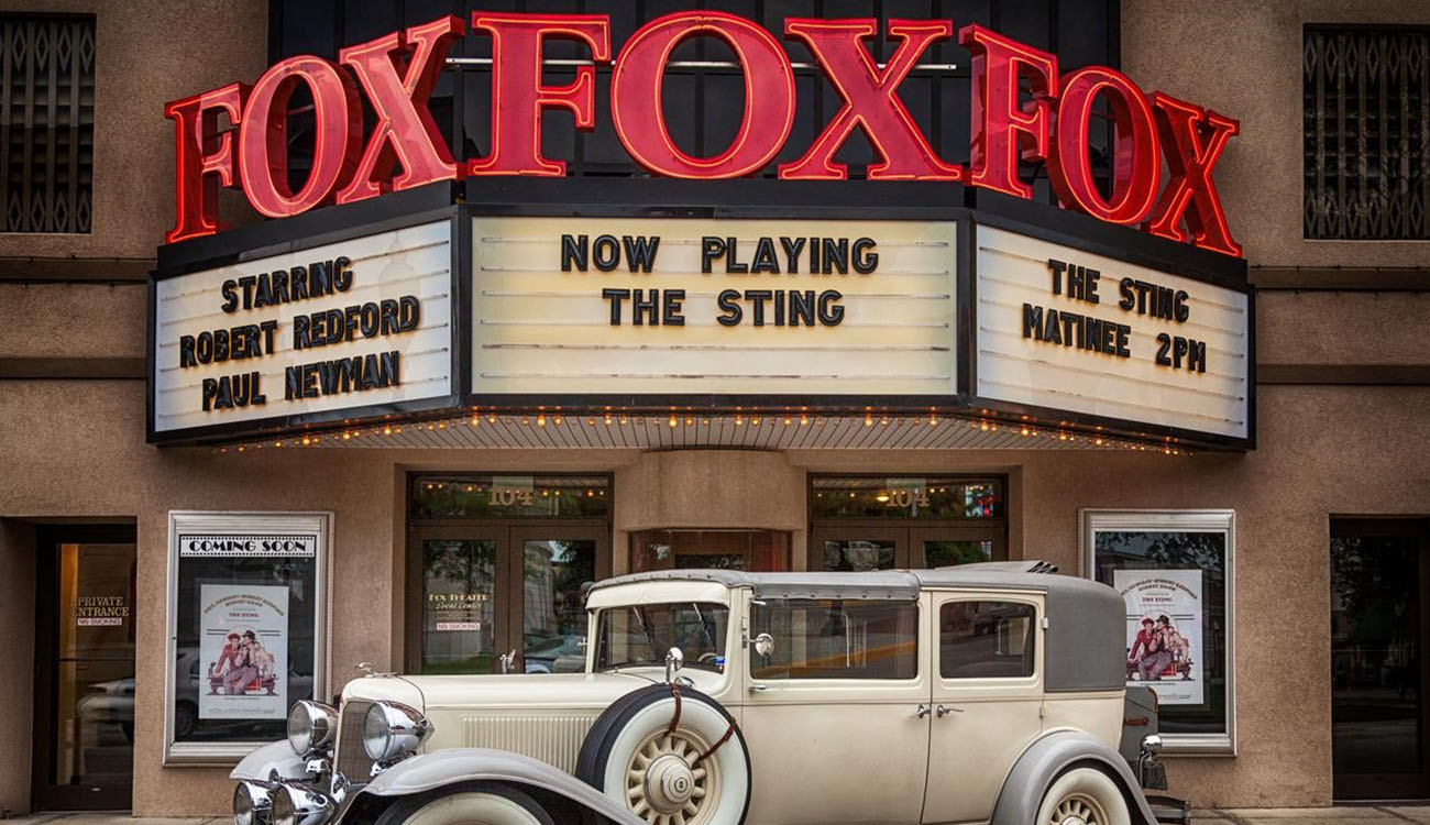 Exterior of the Fox Theater showing the marquee and an antique car