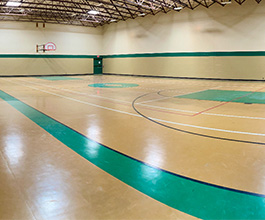 Wide view of the basketball court at the Gym